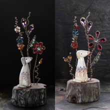 Two Clay Dogs with Swarovski Crystal Flowers on a driftwood slice