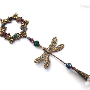 AUBERGINE, EMERALD AND MOUNTAIN BLUE DRAGONFLY SWAROVSKI CRYSTAL WINDOW SUNCATCHER WITH FLORAL FRAME