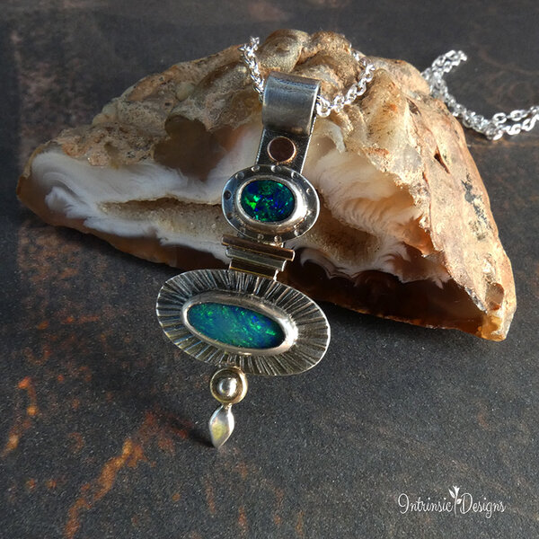 TWO OPALS ON A STERLING SILVER & MIXED METAL PENDANT NECKLACE